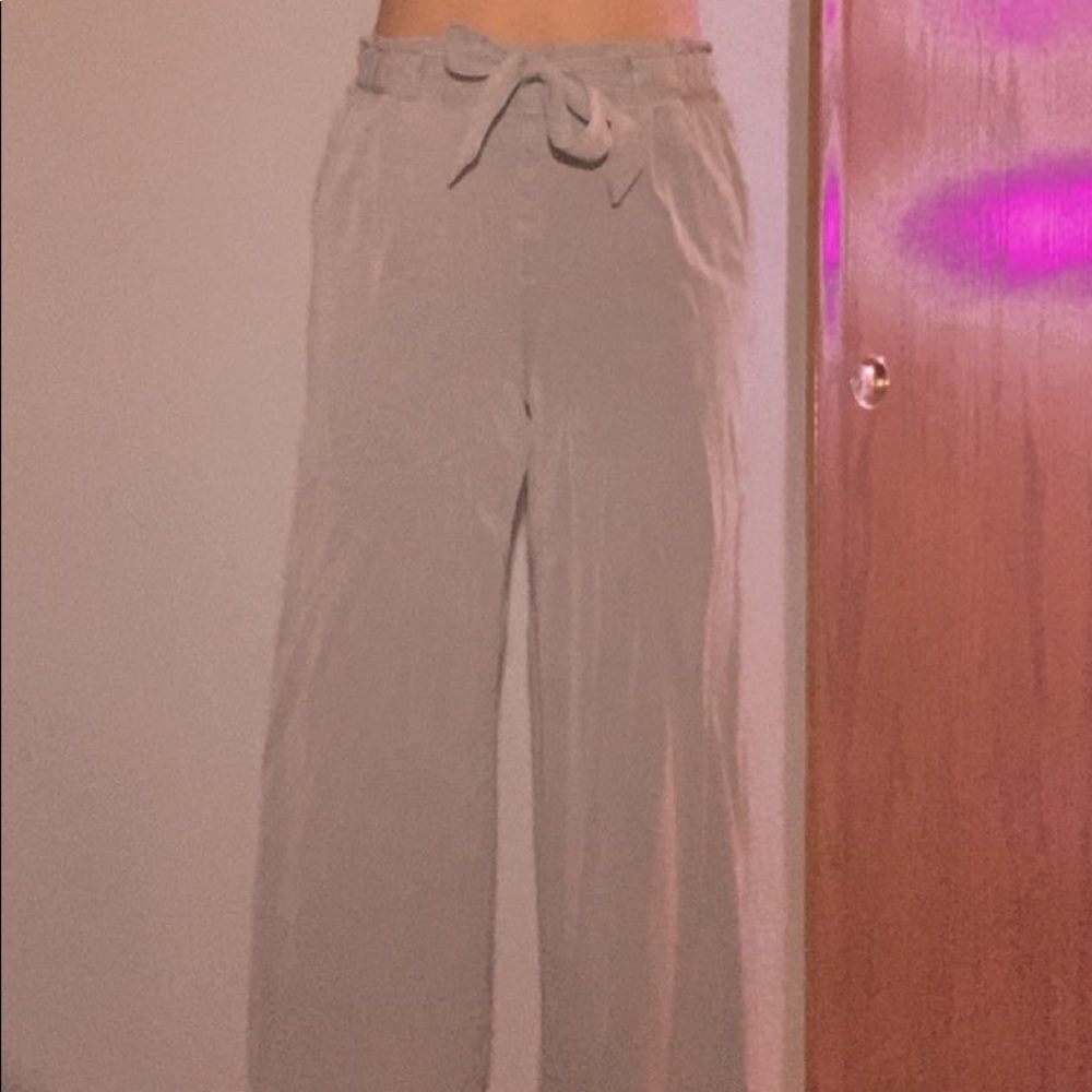 green tie at the waste pants